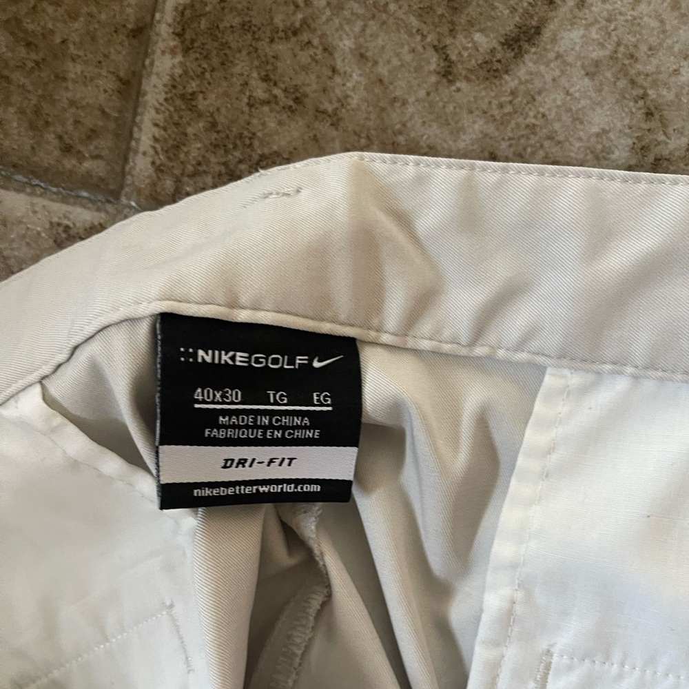 Nike Men’s Golf Pants, have some belts stains on them.